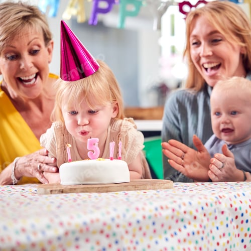 Preview: Grandmother With Mother And Grandchildren Celebrating With Fifth Birthday Party At Home