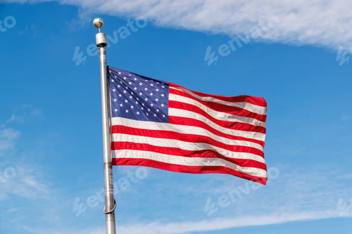 Preview: American flag waving against a blue sky