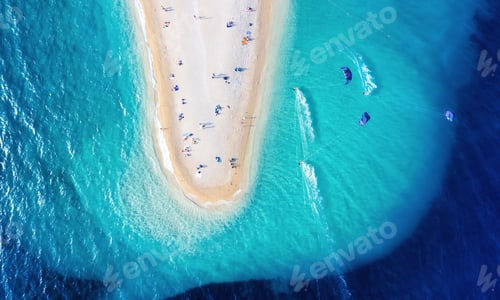 Preview: Aerial view on the beach and windsurfer. Beach and sea from air. Sport composition.
