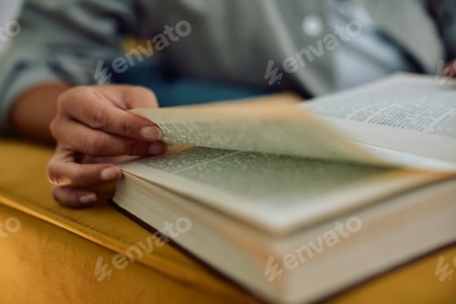 Preview: Close up of woman reading book.