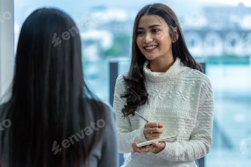 Preview: Asian woman professional psychologist doctor giving the consult to female patients