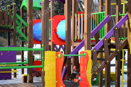 Preview: Fragment of a playground made of plastic and wood, painted in different colors