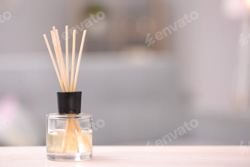 Preview: Handmade reed freshener on table against blurred background