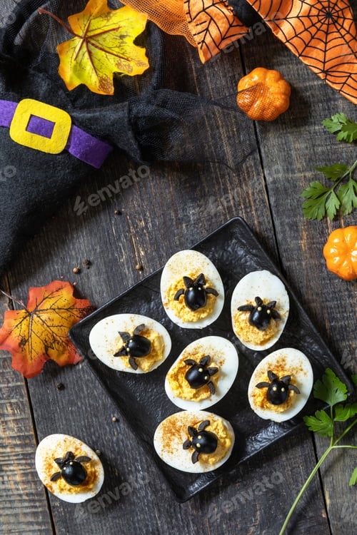 Preview: Halloween funny idea for party food. Halloween creative set stuffed eggs with paprica and bat.
