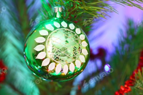 Preview: green ball hanging on pine branches