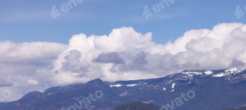 Preview: Puffy Clouds over Canadian Mountain Landscape, Sunny Day.