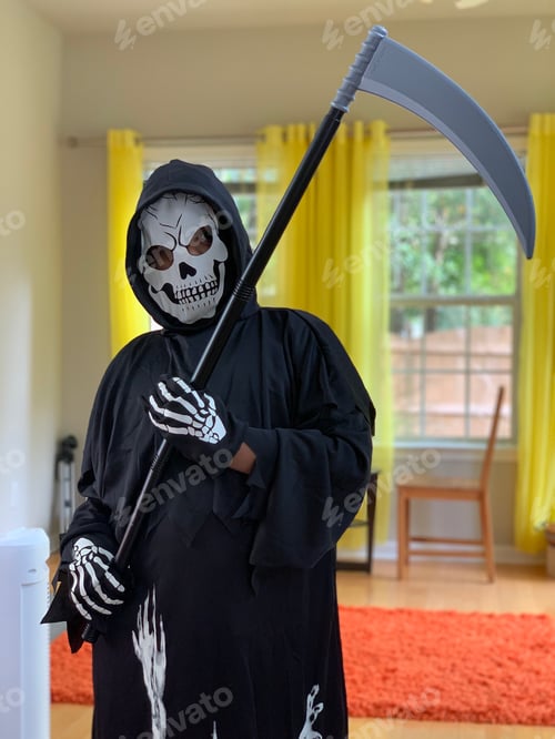 Preview: Costumed Figure Holding Scythe Indoors
