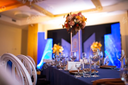 Preview: Festive Christmas, wedding, birthday table setting with blue tablecloth, orange napkin cutlery,
