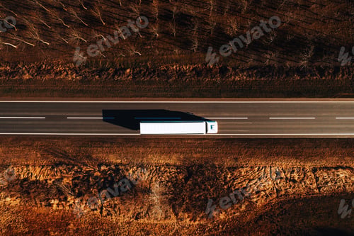 Preview: Freight transportation and logistics from above, drone photography of truck on the road