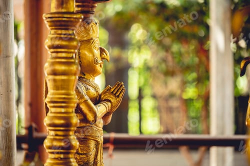 Preview: Closeup shot of Hinduism god statues covered by gold found in Hindu temples