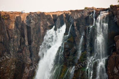 Preview: Victoria Falls, huge waterfalls of the Zambezi river flowing over sheer cliffs.