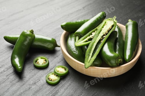 Preview: Ripe green jalapeno peppers on grey table, closeup