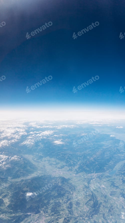 Preview: Top view of mountains with snow and clouds. View of the Alps.