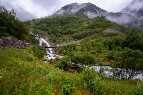 Preview: Lush Green Landscape With a Bridge