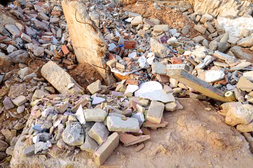 Preview: Valencia, Spain - August 6, 2019: Debris thrown in an illegal landfill of a construction site.