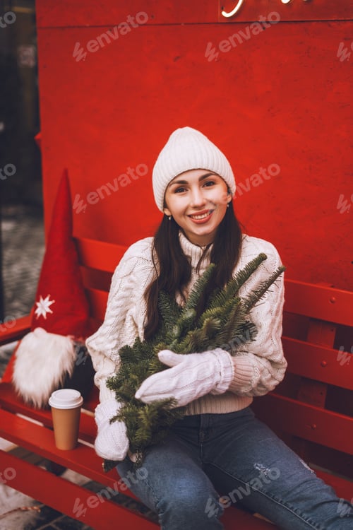 Preview: Woman with Christmas Tree on a Red Bench