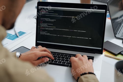 Preview: Developer writing codes on computer