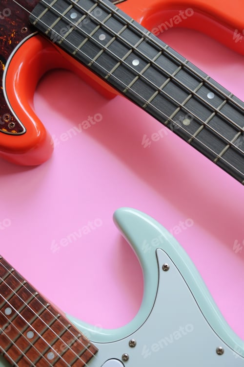 Preview: Electric guitar and bass guitar on a pink background