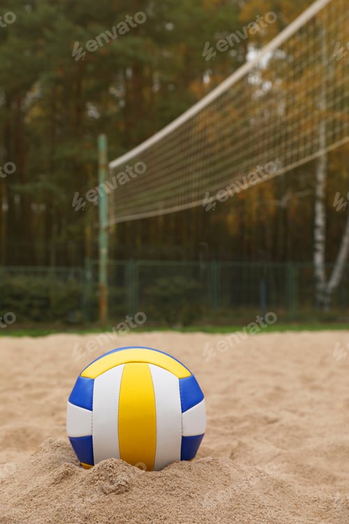Preview: Colorful volleyball ball on sand court, space for text
