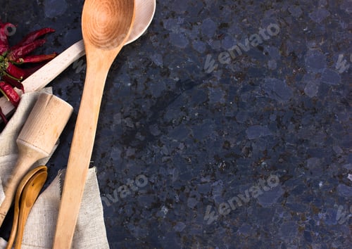 Preview: Old wooden kitchen utensils or cooking tools and bowls on gray background, top view, flat lay. Kitch