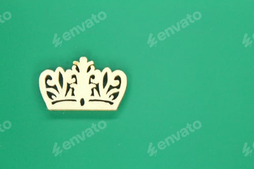 Preview: wooden crown with green background. king concept
