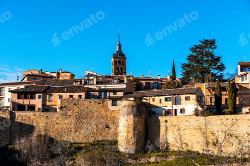 Preview: Picturesque Segovia cityscape under a bright blue sky.