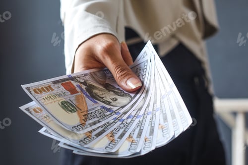 Preview: Close-up of hundreds usd dollars holded by hands