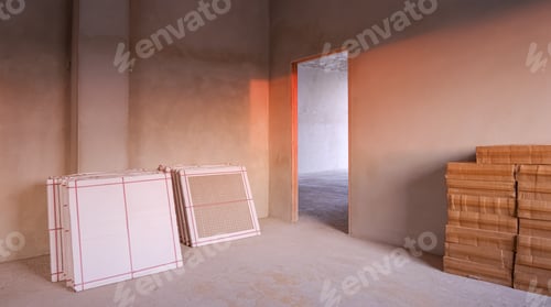 Preview: New floor tiles in cardboard boxes on the floor inside of concrete room in construction site