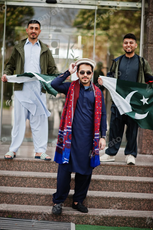 Preview: Group of pakistani man wearing traditional clothes salwar kameez or kurta with Pakistan flags.