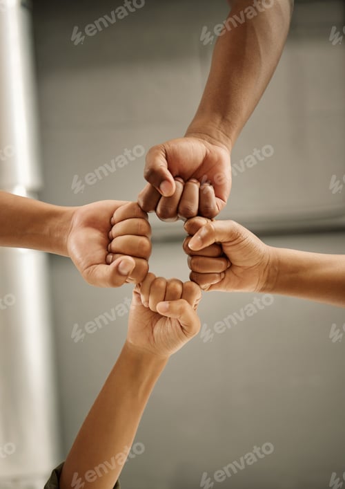 Preview: Closeup of hands of colleagues with fists joined. Zoom into hands of coworkers fists joined from be