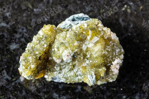Preview: raw druse of topazolite andradite mineral on black