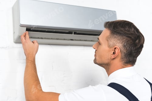 Preview: handsome repairman fixing air conditioner