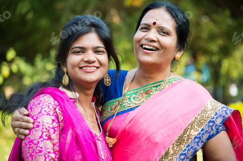 Preview: Portrait of happy mother and daughter embracing.