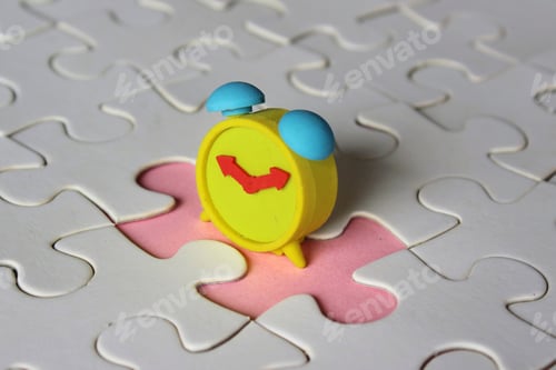 Preview: Missing jigsaw puzzle pieces and alarm clock