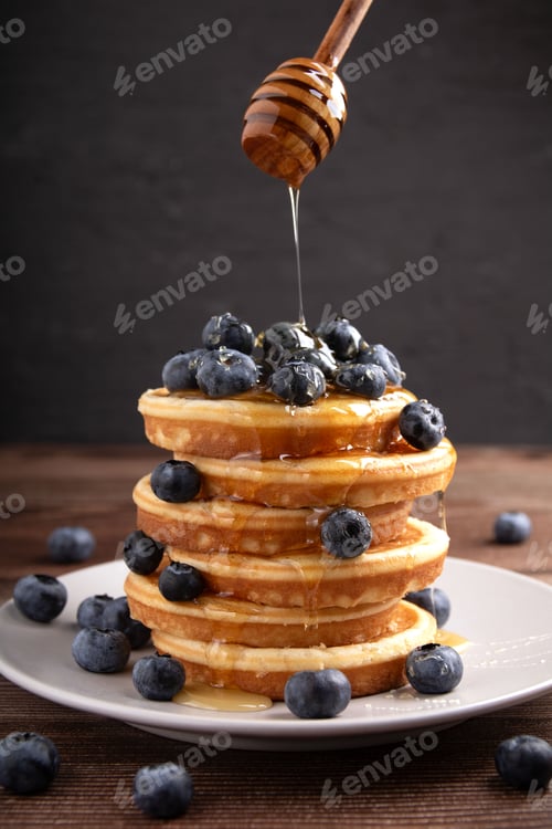 Preview: Stack pancakes with blueberries and honey, a delicious homemade breakfast, sweet and gourmet treat