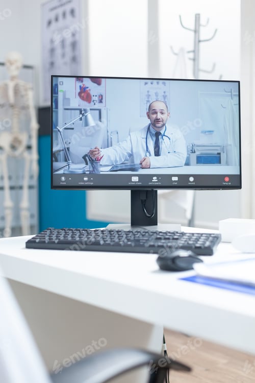 Preview: Computer screen with remote doctor having videocall conference meeting