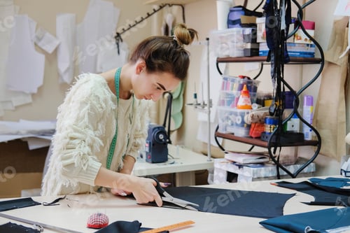 Preview: Female Tailor Working In In The Sewing Workshop.