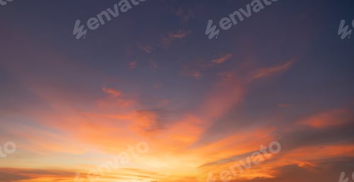 Preview: Sunset sky. Abstract nature background. Dramatic blue and orange, colorful clouds at twilight time.