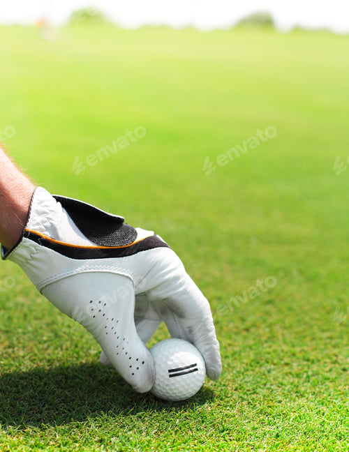 Preview: Golf player man holding golf ball