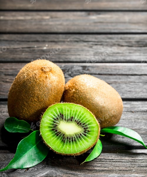 Preview: Ripe kiwi with leaves.