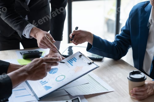 Preview: Asian business people brainstorming in a graph analytical computing plan meeting. data chart Marketi