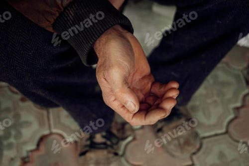 Preview: Close up extended arm of an elderly man asking for help or money. Poverty, donations, unemployment.