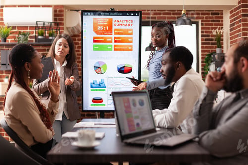 Preview: Diverse colleagues working at marketing presentation analyzing financial graph
