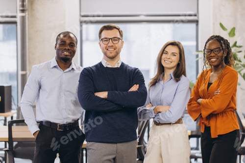 Preview: Confident businesspeople standing together in modern office, representing teamwork, diversity