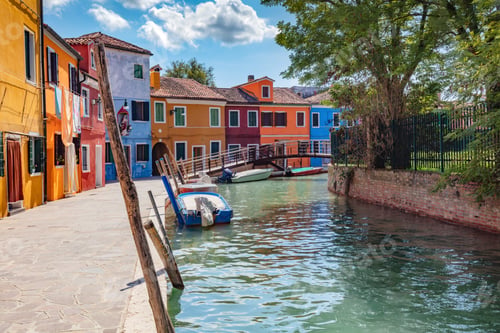 Preview: Burano, Italy with colorful painted houses along canal with boats