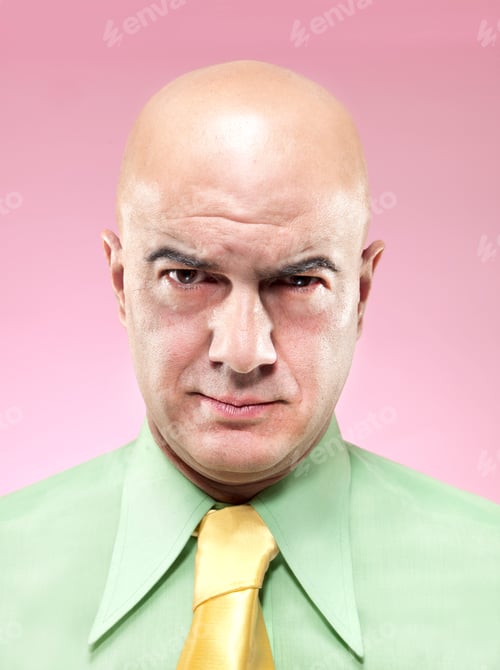 Preview: Bald man frowning