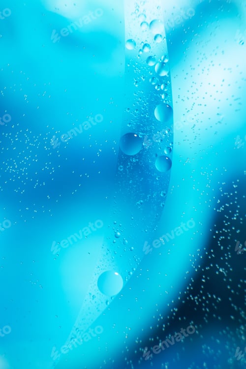 Preview: Oil bubbles close up. circles of water macro. abstract light blue background
