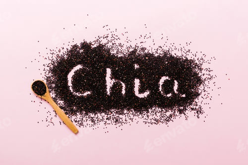 Preview: chia word made from chia seeds top view on colored background. Healthy superfood
