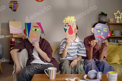 Preview: Group of Generation Alpha Children Holding Handmade Masks Indoors
