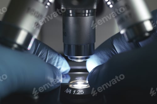 Preview: Scientist hands with microscope